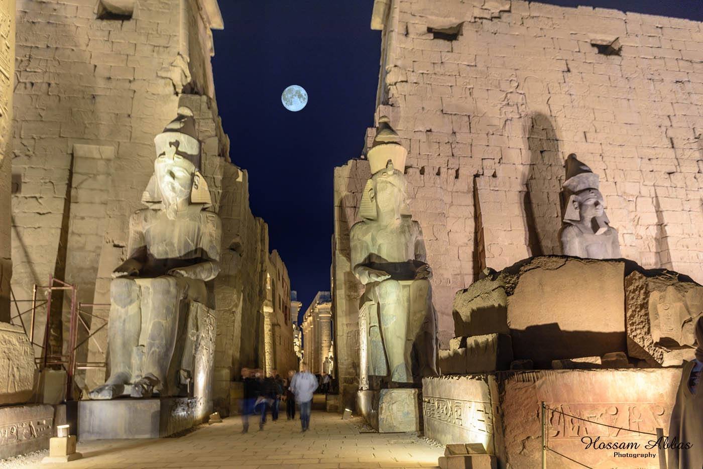 Scenic view of Luxor Temple illuminated at sunset on a budget trip
