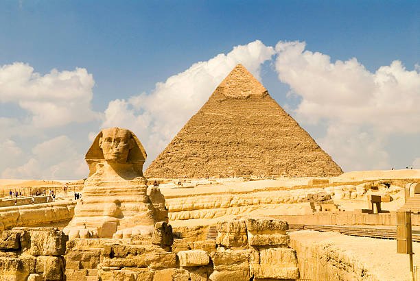 Stand before the iconic Giza Pyramids and the Great Sphinx