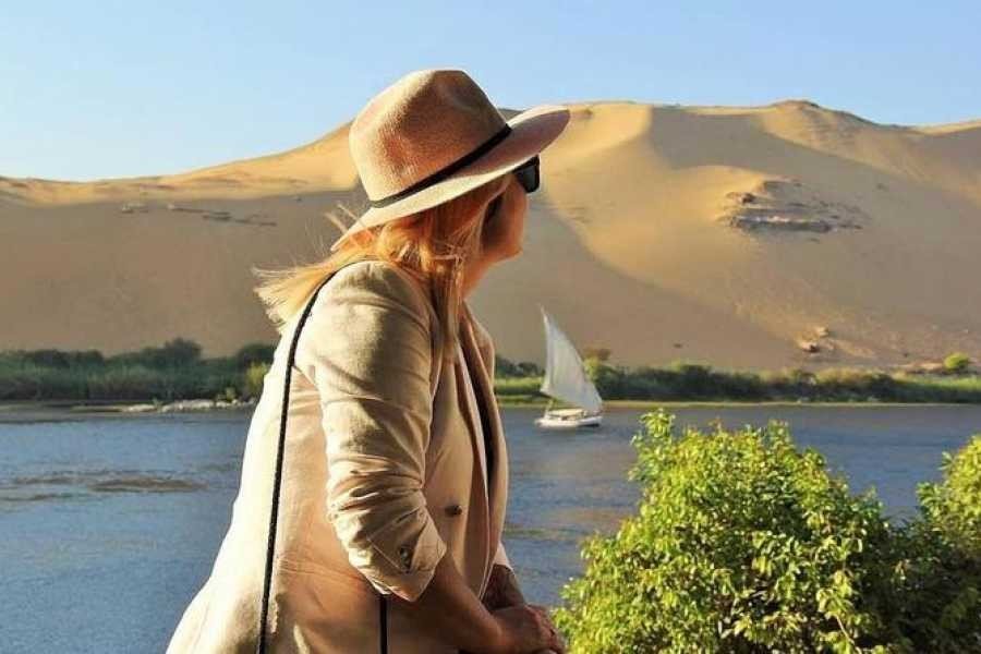 Nile River scenery between Luxor and Aswan with traditional felucca boats