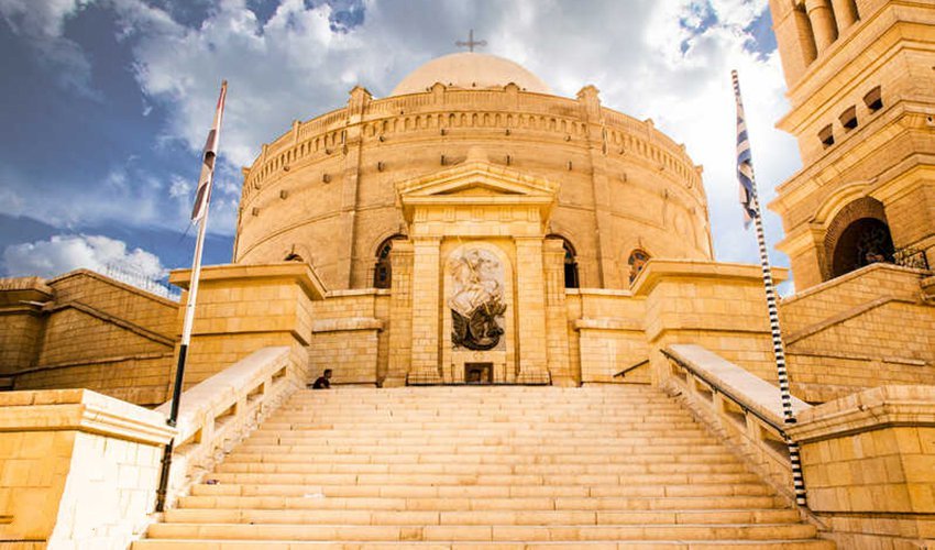 The Greek Orthodox Church of St. George in Old Cairo, featuring its distinctive circular structure and elegant dome above the historic Roman fortress.