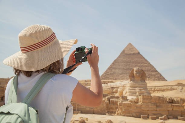 World traveler visits Kheops pyramid (Khufu), Khafra and Menkaura Giza Pyramids and the Great Sphinx in Cairo Egypt