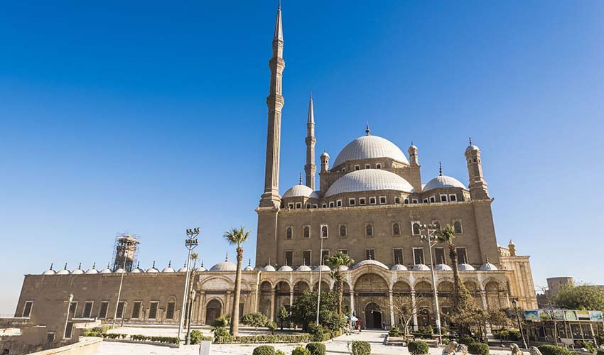 The Mosque of Mohamed Ali inside Cairo Citadel, featuring its grand Ottoman domes and tall minarets overlooking the city of Cairo.